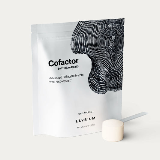 A white stand-up pouch of Elysium Cofactor collagen powder with a black wood-grain graphic, shown on a light gray background with a small off-white scoop in front.