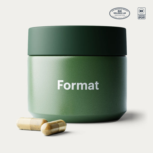 A matte dark green supplement jar labeled 'Format' on a light gray background, with two capsules placed in front and certification logos in the top right corner.